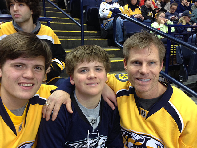 NuBody Concepts plastic surgeon Dr Rosdeutscher with his sons at a Predators game