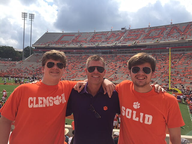 NuBody Concepts plastic surgeon Dr Rosdeutscher with his sons watching college football