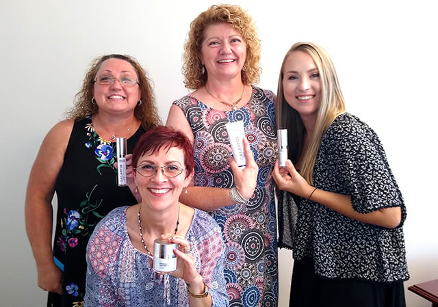 NuBody Concepts staff with their favorite ALASTIN Skincare product