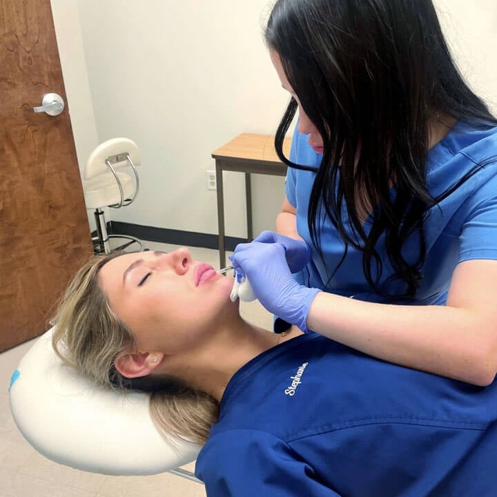 NuBody Concepts MedSpa Nashville nurse injector Keeli administering lip filler on patient
