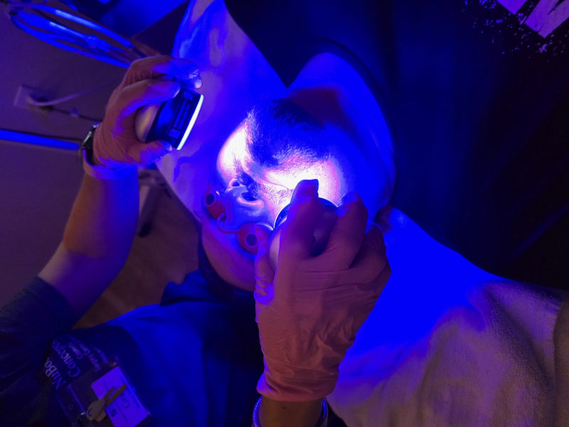A male patient a facial treatment.